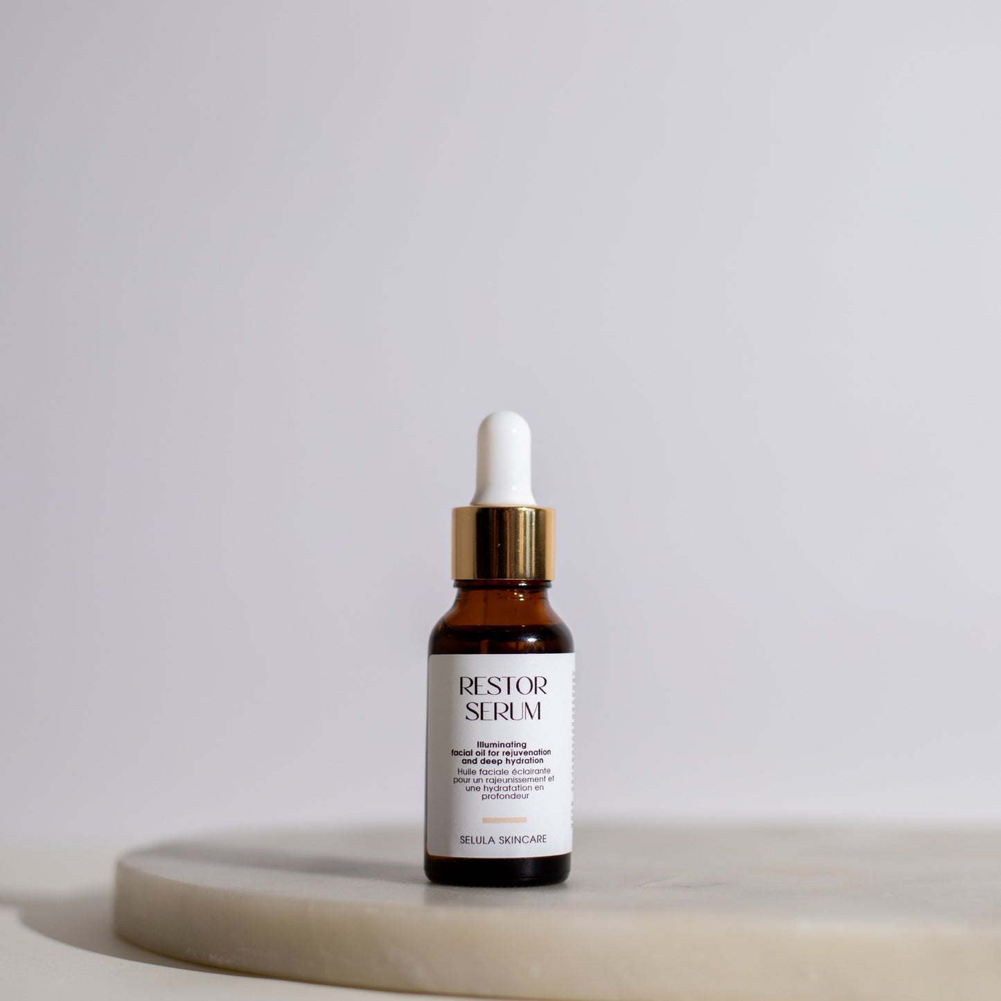Skincare serum bottle on a white background